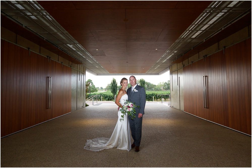 Bride and groom in tunnel at Mandoon Estate