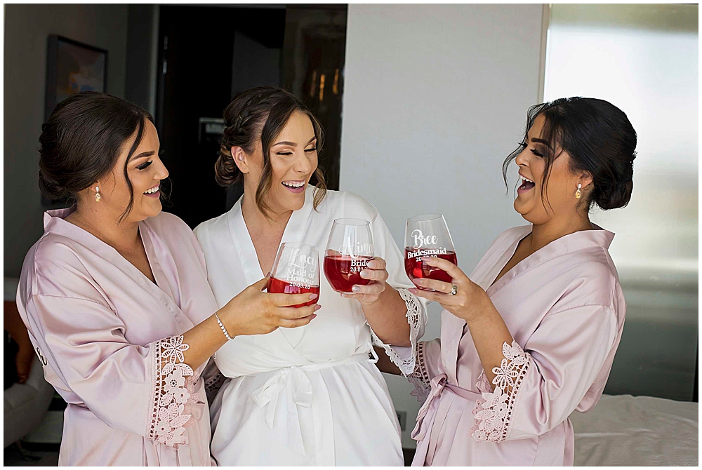 Bride and bridemaids having a drink