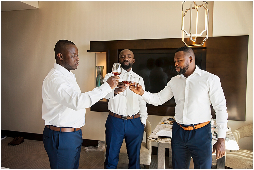 groom and groomsmen having a drink