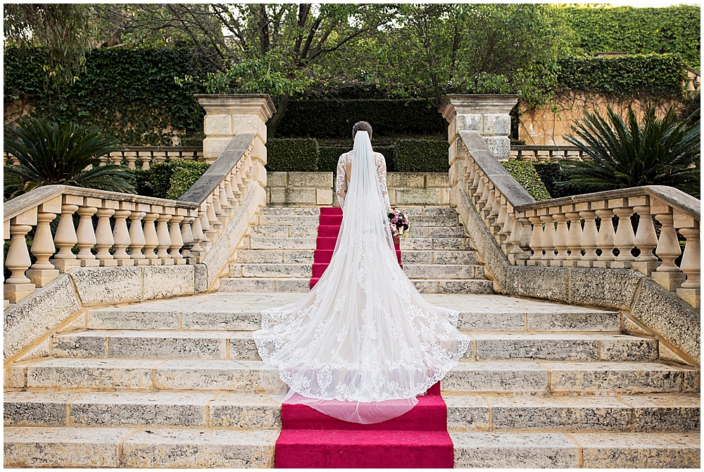 bride in dress on staircase at Caversham House